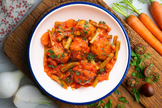Meatballs with tomato and vegetable sauce. Overhead view of the table. 