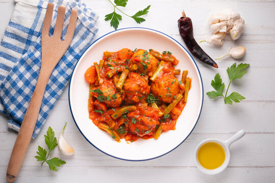 Meatballs with tomato and vegetable sauce. Overhead view of the table. 