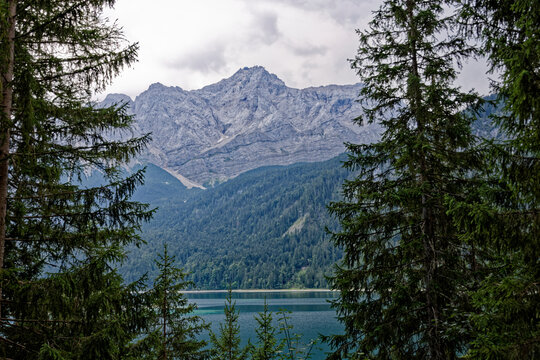 Turquoise Waters and Islands of Lake Eibsee Beneath Zugspitze Mountain Peak