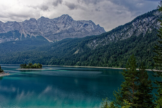 Turquoise Waters and Islands of Lake Eibsee Beneath Zugspitze Mountain Peak