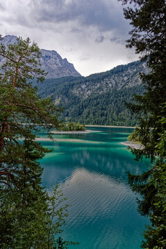 Turquoise Waters and Islands of Lake Eibsee Beneath Zugspitze Mountain Peak