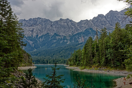 Turquoise Waters and Islands of Lake Eibsee Beneath Zugspitze Mountain Peak
