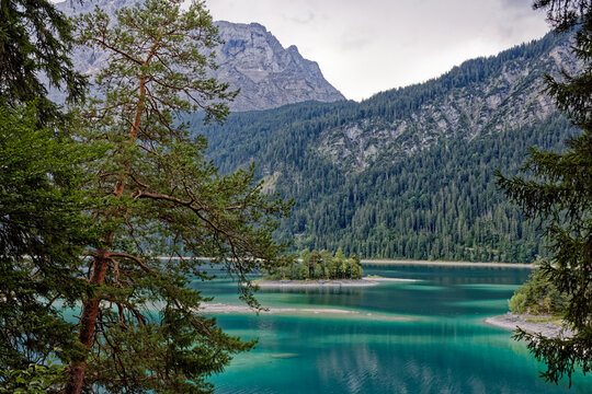 Turquoise Waters and Islands of Lake Eibsee Beneath Zugspitze Mountain Peak
