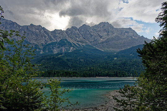 Turquoise Waters and Islands of Lake Eibsee Beneath Zugspitze Mountain Peak