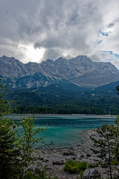 Turquoise Waters and Islands of Lake Eibsee Beneath Zugspitze Mountain Peak