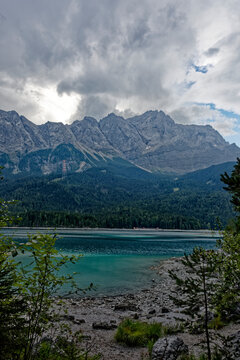 Turquoise Waters and Islands of Lake Eibsee Beneath Zugspitze Mountain Peak