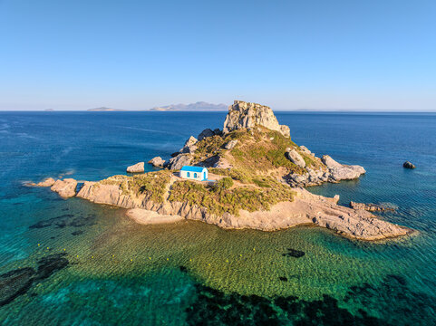 Kastri Islet with the Chapel of Agios Nikolaos in Kefalos Gulf, Greece