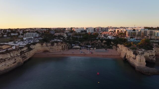 Aerial view of senhora da rocha beach in portugal at sunset