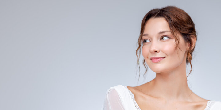 Smiling Woman With Natural Makeup in Romantic Studio Lifestyle Portrait
