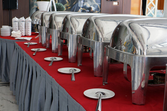 Buffet Catering Setup with Polished Chafing Dishes for Event Dining
