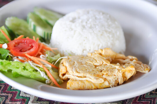 omelette, omelet or  fried egg and rice or Thai omelet with rice and vegetable