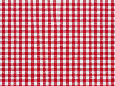 Classic red and white gingham checkered tablecloth fabric pattern texture