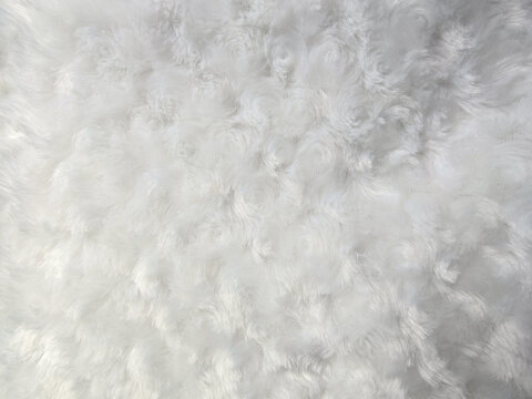 Soft white fluffy fur fabric texture background