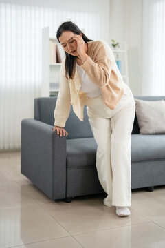 Woman hand on forehead, feeling unwell,dizzy and headache at home.