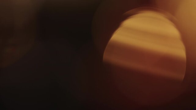 Slow motion real lens flare from back sunlight over dark background for overlay