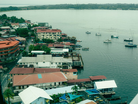 Coastal village with red roofs and boats