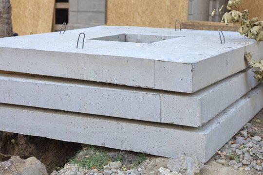 Stacked precast concrete foundation slabs