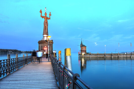 Night in Konstanz harbour with the Imperia statue and the Lighthouse, Germany