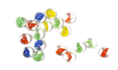Obraz premium Colorful glass marbles grouped together isolated on white background, top view