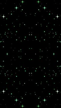 Symmetrical glowing green stars and magical twinkling particles on black.