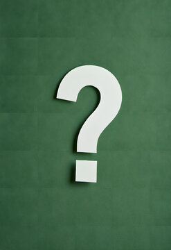 On a green background, questions about symbol uncertainty and the integration of problem-solving concepts into business decisions and strategy in education arise