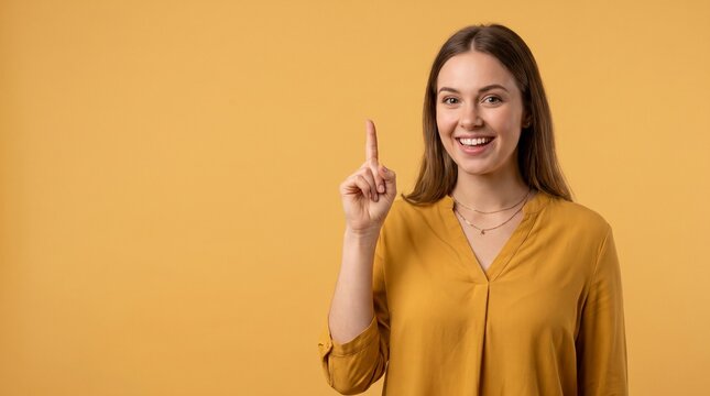 Cherrful female teacher presenting education idea on yellow background 