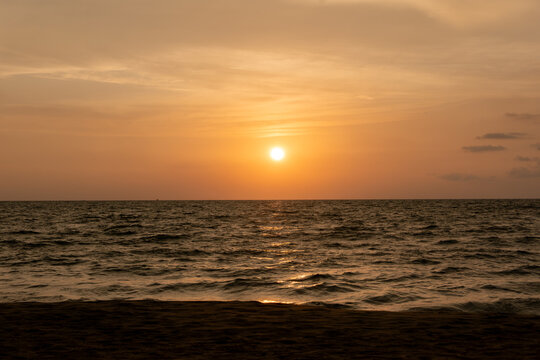 harmonic background of scenic sunset with bright sun at the ocean