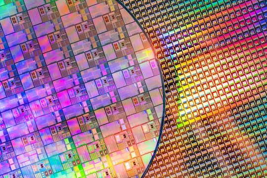 High-tech Macro Photography of a Colorful Silicon Wafer with Microchip Patterns for AI Hardware and Semiconductor Industry Concept.