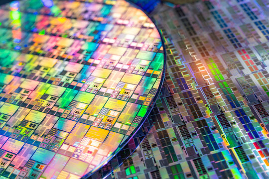 High-tech Macro Photography of a Colorful Silicon Wafer with Microchip Patterns for AI Hardware and Semiconductor Industry Concept.
