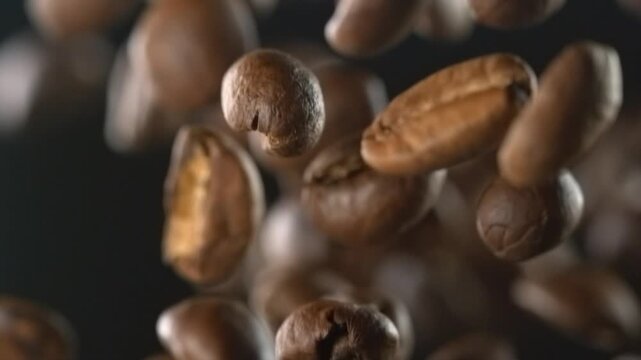 Coffee beans falling through the air in slow motion