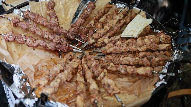 Grilled Shashlik Meat Skewers Arranged in a Tray with Lavash Flatbread