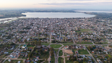 Fototapeta premium Aerial view of San Miguel del Monte and Laguna de Monte at dawn, Argentina.