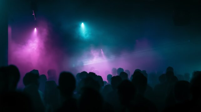 Crowd at a vibrant nightlife event with colorful lights and fog in a club setting