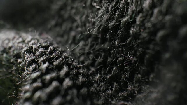 Macro close-up of dark black woven fabric texture