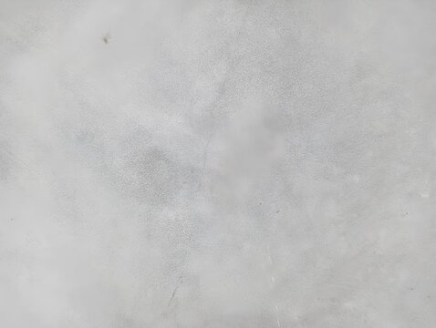 Natural unpainted wall, grunge texture, wide horizontal banner background with spacious copy space for text. Rough gray surface with chips, cracks, scratches, stains, and distressed details. 