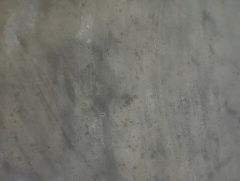 Natural unpainted wall, grunge texture, wide horizontal banner background with spacious copy space for text. Rough gray surface with chips, cracks, scratches, stains, and distressed details. 