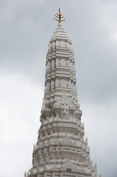 Tall, White Prang model with Buddhist figures sculpted in Bangkok Thailand
