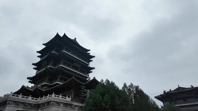 Chaoran Tower beneath dramatic cloudy skies