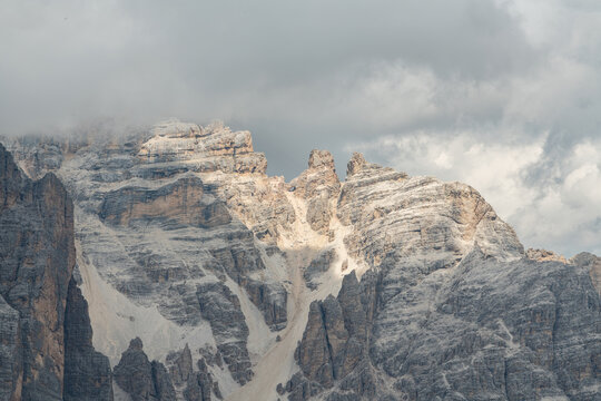 Cortina d'Ampezzo, Italy. Tofane mountain massif rising above the Dolomites under dramatic clouds