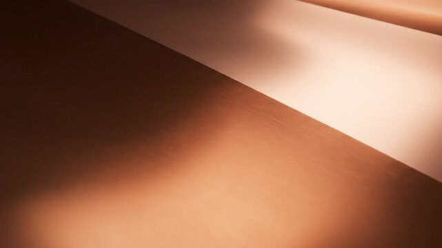 Abstract copper surface with light reflection and smooth textures creating a modern background with space for text or design