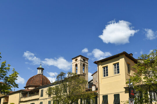 Dome and bell tower of the historic San Girolamo Auditorium ex church under a blue sky, Lucca, Tuscany, Italy