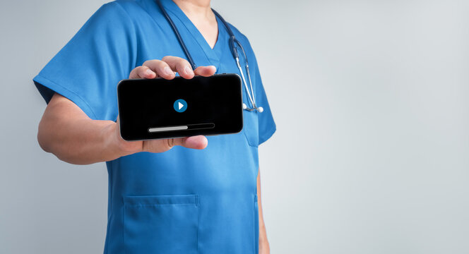 Healthcare professional presents educational video content on smartphone. Digital patient education, mobile health communication, health literacy, remote guidance and modern medical support concept.