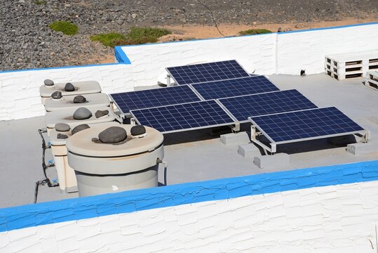 Solar panels on a building rooftop, Los Molinos, Fuerteventura, Canary Islands, Spain, Europe.