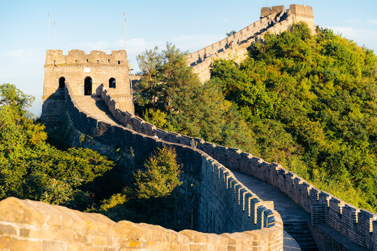 Tourists hike along the Great Wall of China to sightsee and enjoy the ancient architecture