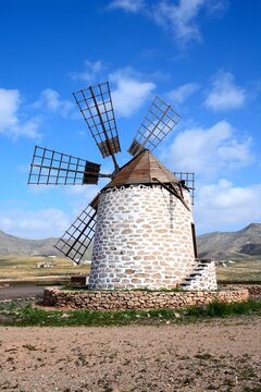 View of a traditional windmill and surrounding countryside, Tefia; Fuerteventura, Canary Islands, Spain, Europe.