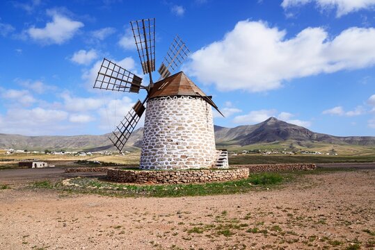 View of a traditional windmill and surrounding countryside, Tefia; Fuerteventura, Canary Islands, Spain, Europe.