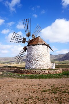 View of a traditional windmill and surrounding countryside, Tefia; Fuerteventura, Canary Islands, Spain, Europe.