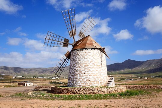 View of a traditional windmill and surrounding countryside, Tefia; Fuerteventura, Canary Islands, Spain, Europe.
