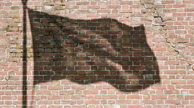 Waving flag shadow and its pole creating a symbolic representation of national pride, heritage, and government on a weathered red brick wall with texture, suitable for abstract backgrounds