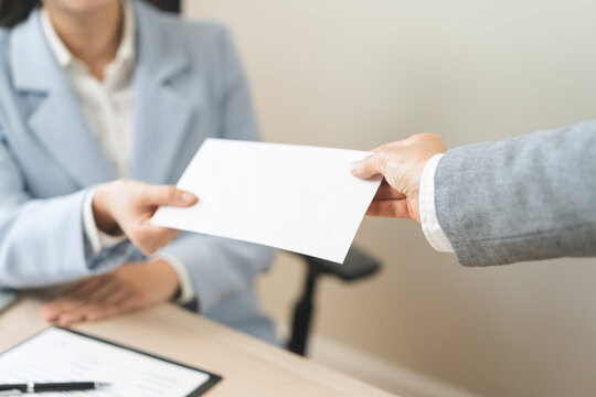Good job, asian manager business giving financial reward in an envelope, business letter extra salary to company employee, woman worker office hand received premium bonus, getting cheque from her boss